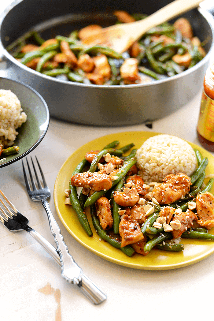 We are the queens of stir fry and you are going to love our Healthy Kung Pao Chicken recipe! It's made with just 10 simple ingredients and in less than 30-minutes! kung pao chicken with brown rice