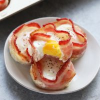 In less than 30 minutes you'll have these high-protein egg cups prepped for the entire week! These bacon wrapped egg cups are made with just 2 ingredients and are gluten-free and paleo-friendly. In one single egg cup you get 9g protein, 0g carb, and 0g sugar!