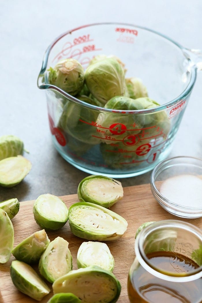 Chopped brussels sprouts on a cutting board.