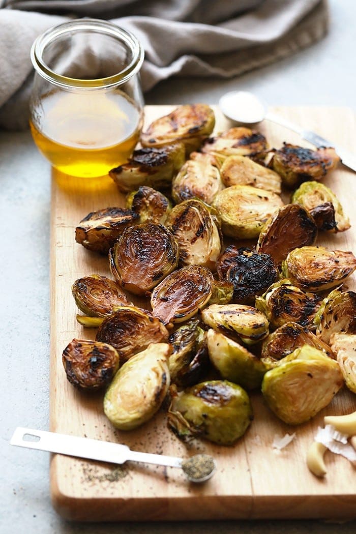 Brussels sprouts on a cutting board.