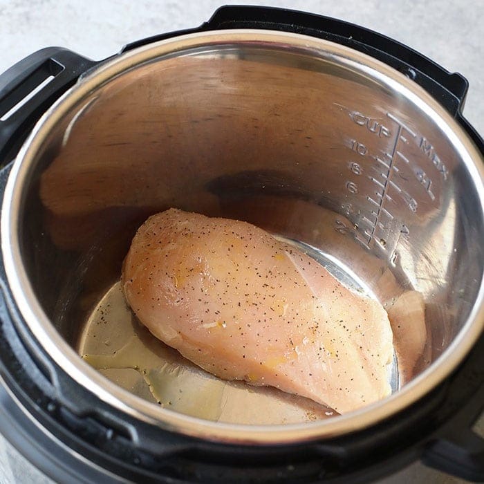 This easy shredded chicken in the Instant Pot recipe is ready in only 8 minutes, and will easily become a meal-prep staple in your home. Season with your favorite spices or sauce and you'll be on your way to an easy and delicious meal. Raw Chicken