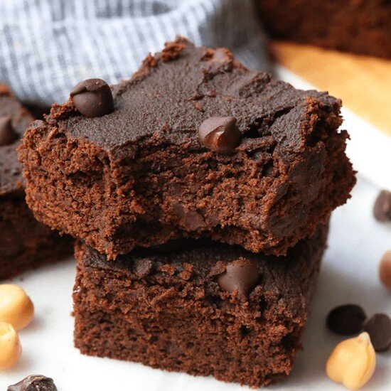 a stack of brownies with peanut butter and chocolate chips.