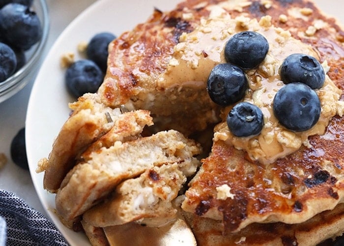 Cottage cheese protein pancakes served with blueberries on a plate