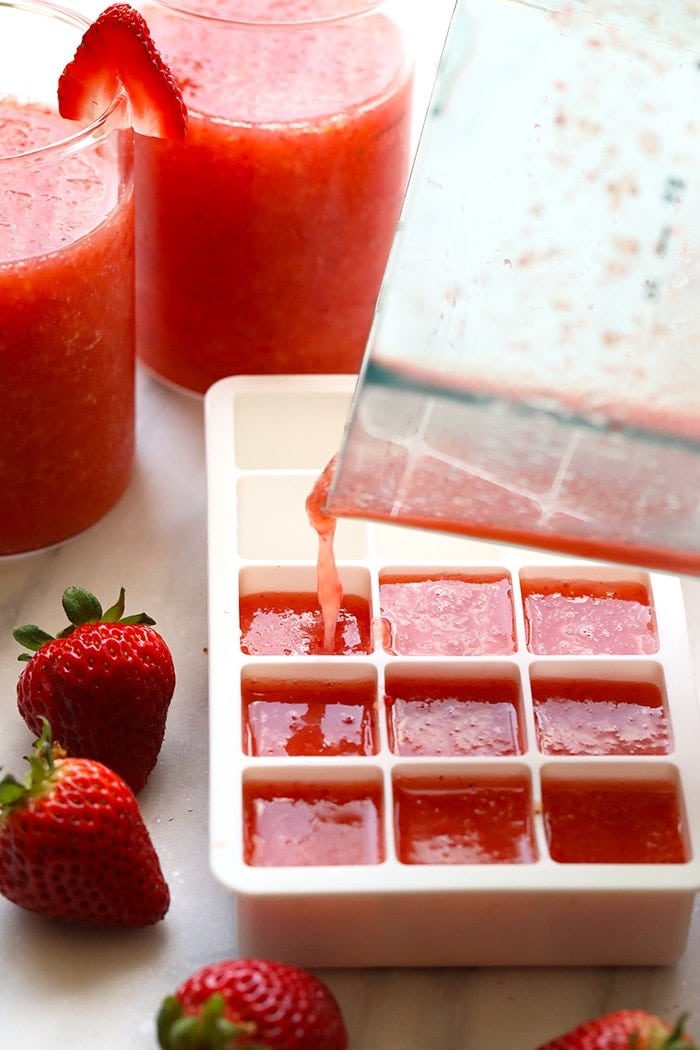 pouring frose into ice cube tray