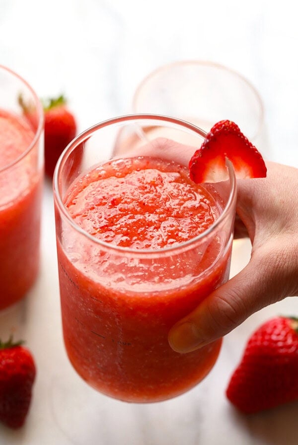The most delicious summer drink you ever did see! This Strawberry Peach Frose Recipe is such a fun frozen drink to make for a crowd. This blended frose recipe calls for a full bottle of rose, frozen strawberries and peaches, rum, and agave nectar!