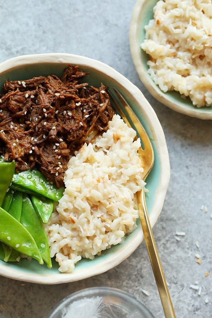 Looking for a perfectly sweetened, creamy coconut rice recipe to add to your next dinner? Look no further, you'll love this refined sugar free coconut rice. This Instant Pot rice is made in under 10 minutes using the manual function and quick release! Coconut rice