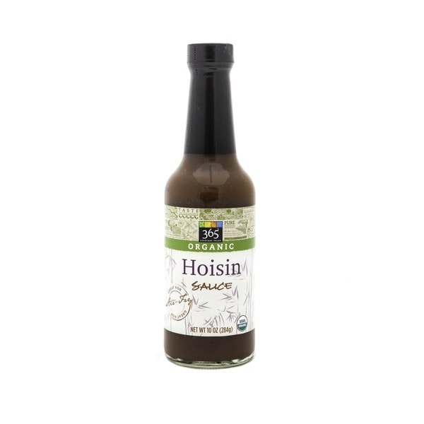 A bottle of hoisin sauce perfect for beef and broccoli dishes, on a clean white background.