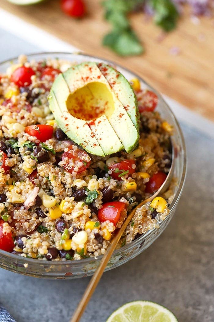 southwest quinoa salad in bowl with avocado