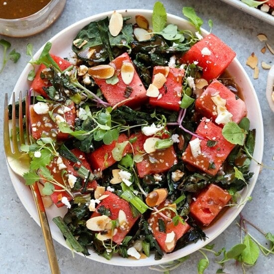 A refreshing watermelon salad with a twist of kale and almonds.