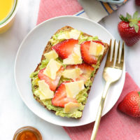 Avocado toast with strawberries and guacamole.