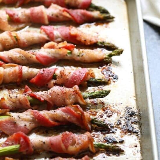 a sheet pan of bacon wrapped asparagus