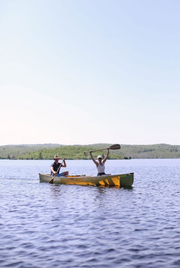 Two people paddling in a Boundary Waters canoe.