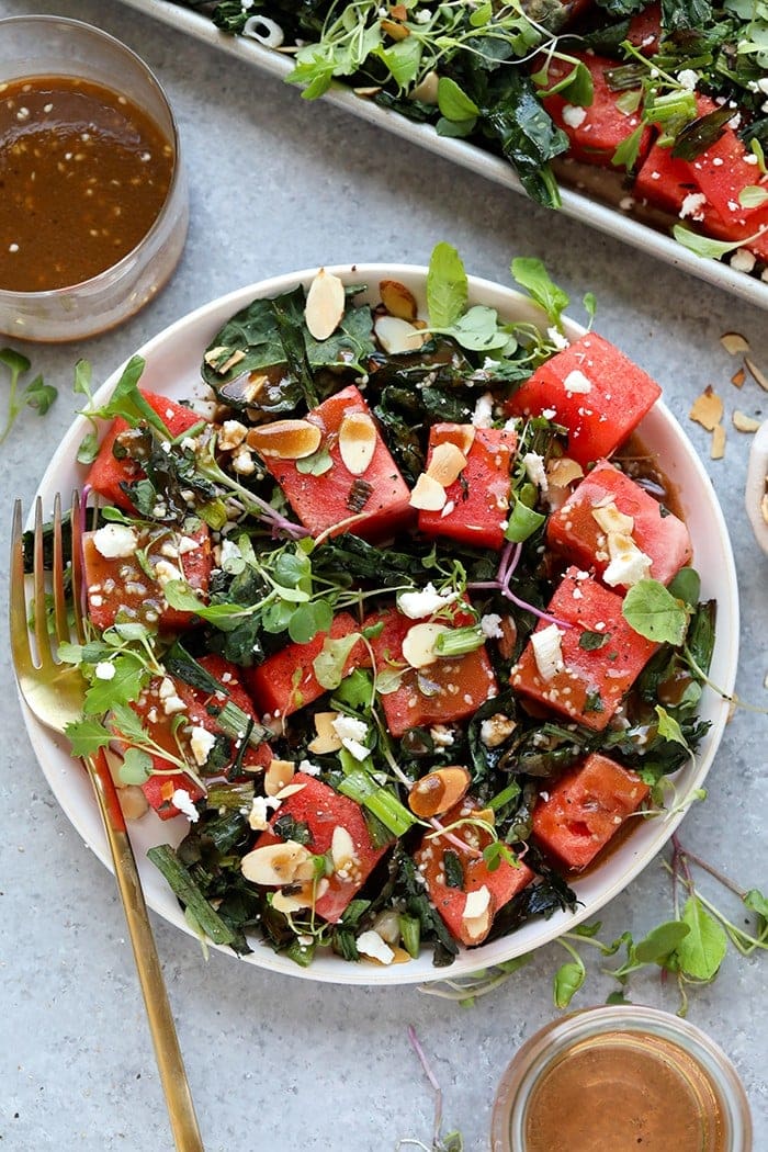 grilled watermelon and kale salad on a plate