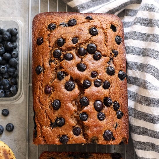 Blueberry banana bread on a cooling rack.