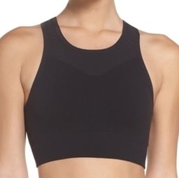 A woman donning a black sports bra.