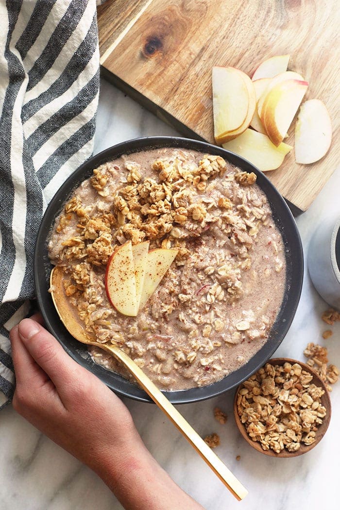 These Apple Cinnamon Overnight Oats will have you eating dessert for breakfast while getting a serving of whole grains and tons of protein at the same time. Prepare this overnight oats recipe the night before and you have an easy breakfast waiting for you in the morning! apple cinnamon overnight oats in a bowl
