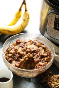 A bowl of banana bread in front of an instant pot.