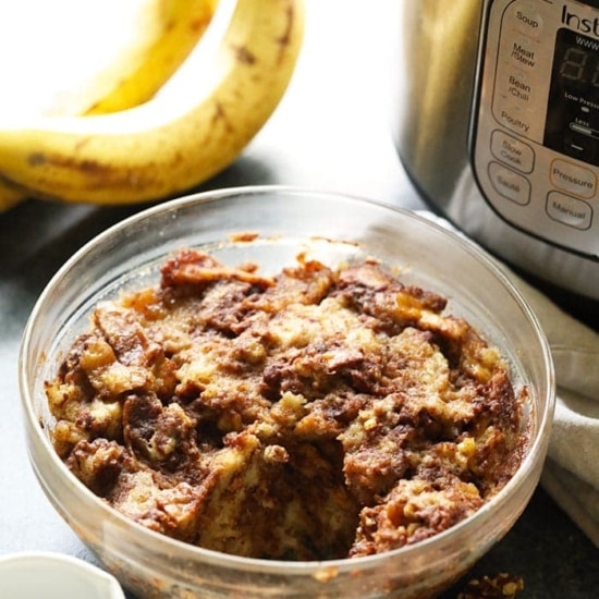 A bowl of banana bread in front of an instant pot.