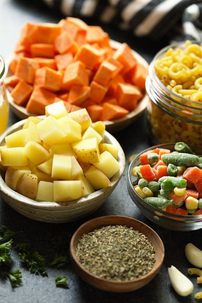 Ingredients for hamburger soup in small bowls