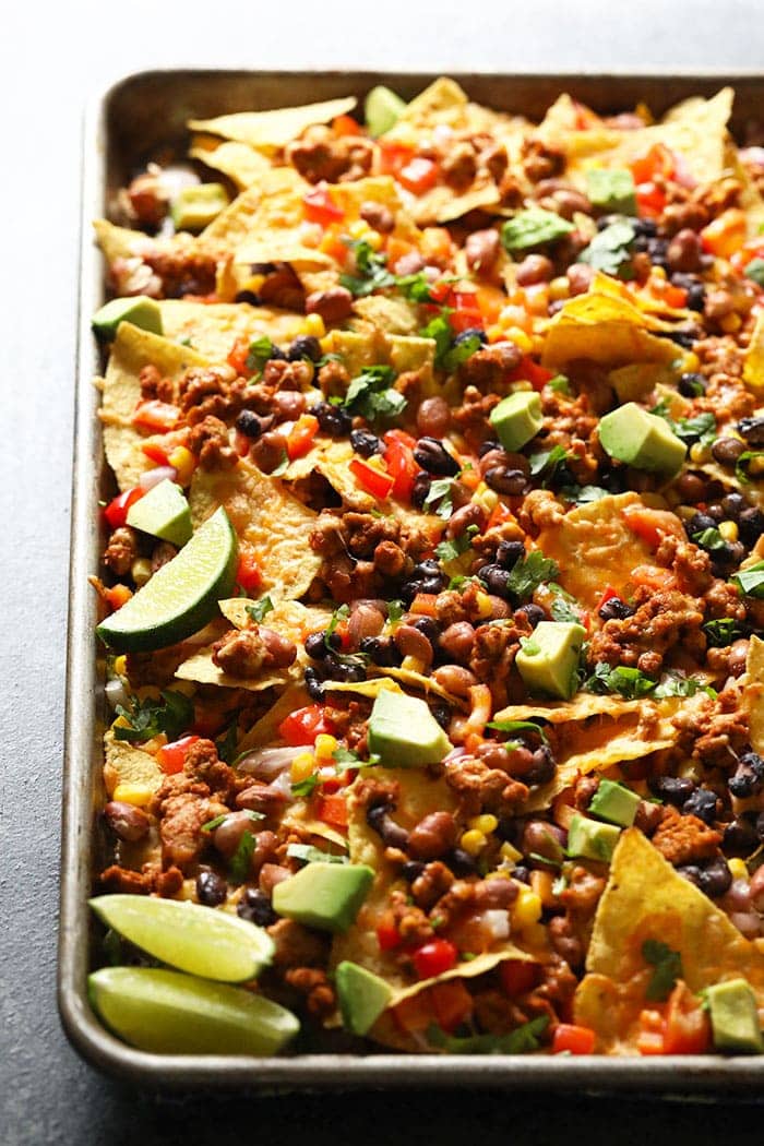 Chicken nachos on baking sheet.