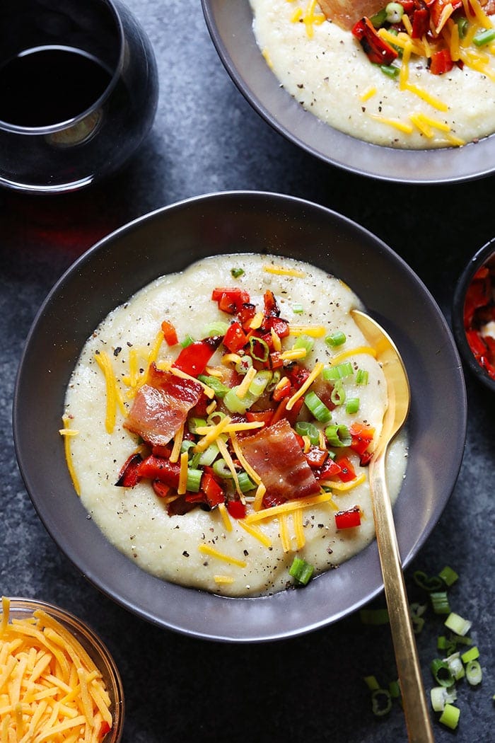 cauliflower potato soup in a bowl loaded with toppings