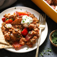 An easy chicken casserole with meat and vegetables on a white plate.