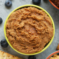 If a churro batter was edible, it would be this recipe! Made with garbanzo beans, coconut sugar, ground cinnamon, and dates, this churro edible cookie dough dip is a healthy dessert or snack option for any day of the week.