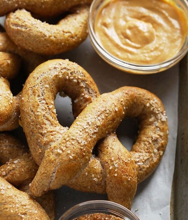 Soft pretzels with peanut butter on a tray.