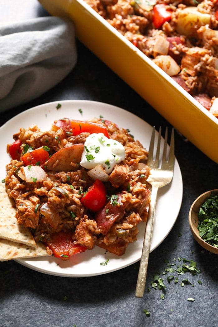 This chicken tikka masala casserole recipe is one of the most delicious and easy chicken casserole recipes around! It has all of the traditional flavors of chicken tikka masala in casserole form. Make this chicken tikka masala casserole for dinner this week! chicken tikka masala on a plate