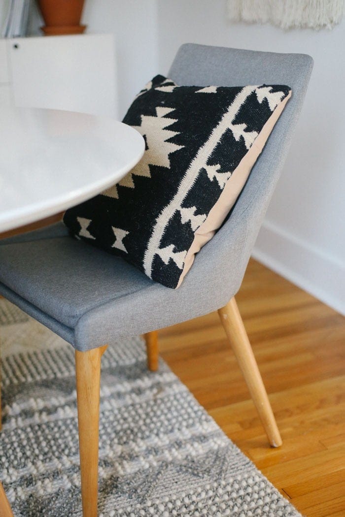 Mid-Century grey chair with aztec pillow