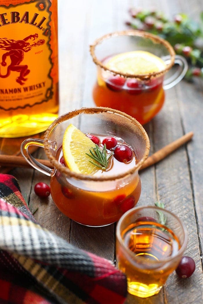 Warm your soul with this homemade hot toddy recipe! This adult beverage mixes together cinnamon whiskey, apple cider, and citrus for a delicious winter drink