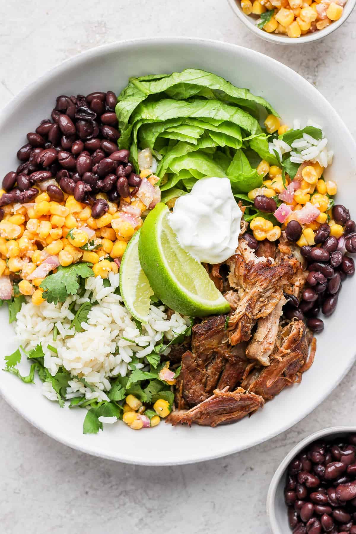 Slow Cooker Carnitas Burrito Bowls - Fit Foodie Finds