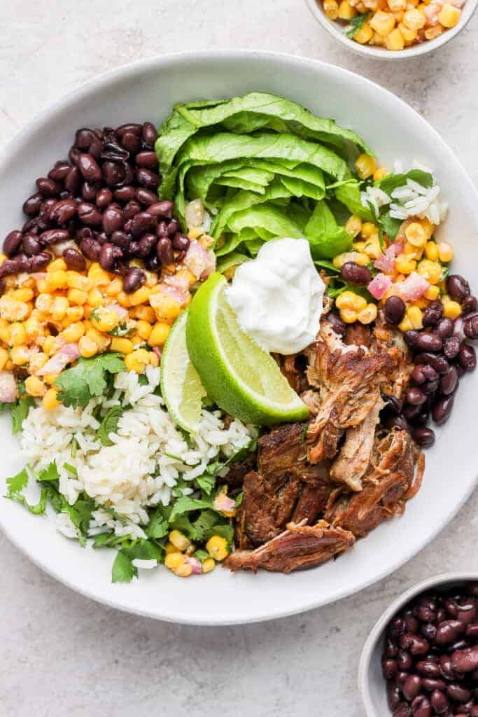 carnitas bowl with street corn salad