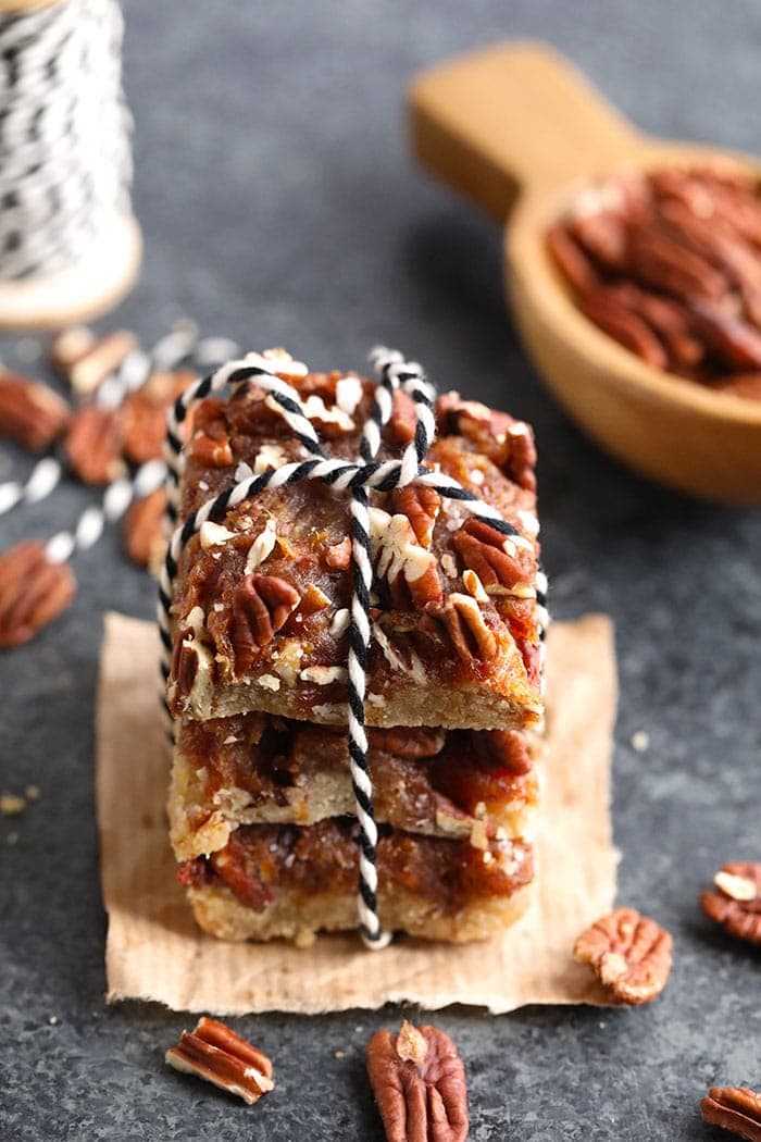 A stack of easy pecan pie bars with twine