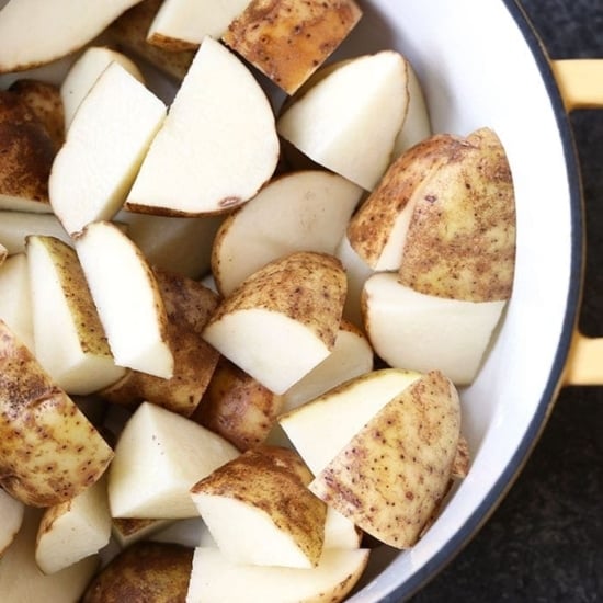 raw potatoes in pot
