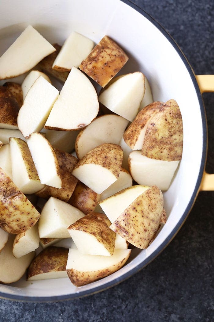 raw potatoes in pot