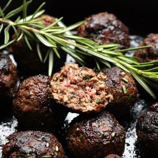 Easy skillet meatball recipe with rosemary sprigs.