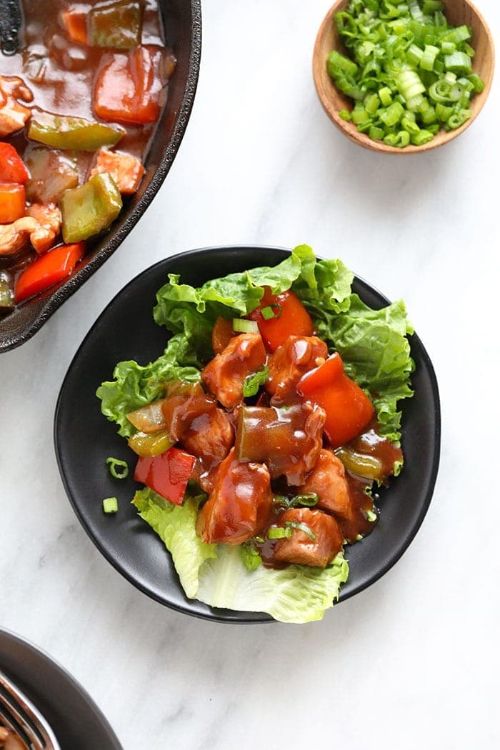 healthy sweet and sour chicken on a lettuce wrap