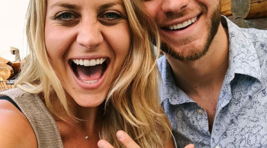 A couple's 2018 recap photo showcases their engagement rings.