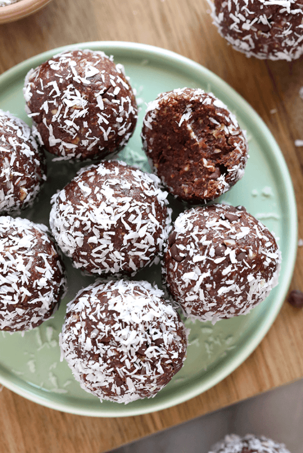 chocolate coconut energy balls on a plate.