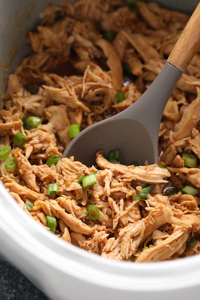 Shredded honey garlic chicken in the slow cooker. 