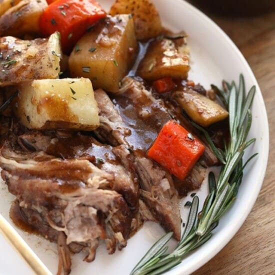 a plate of instant pot pork roast, potatoes and carrots