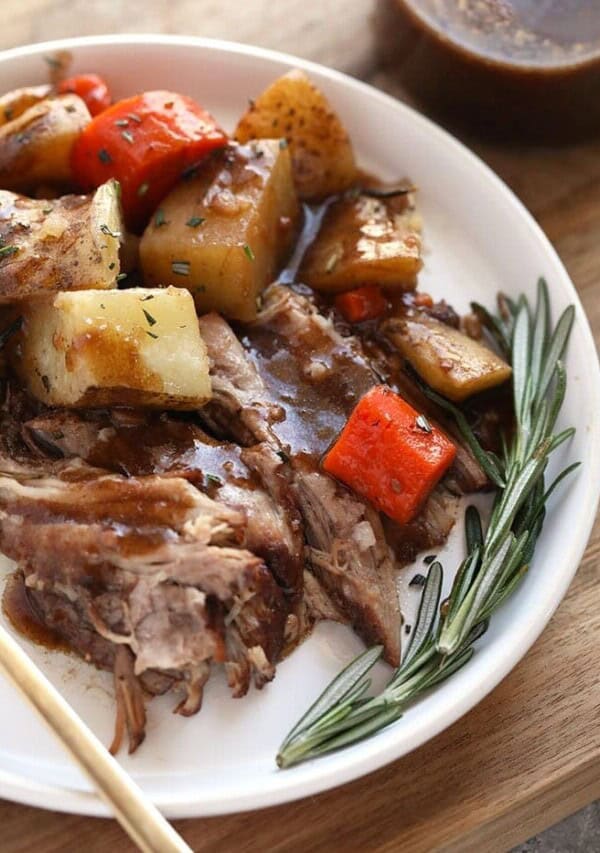 a plate of instant pot pork roast, potatoes and carrots