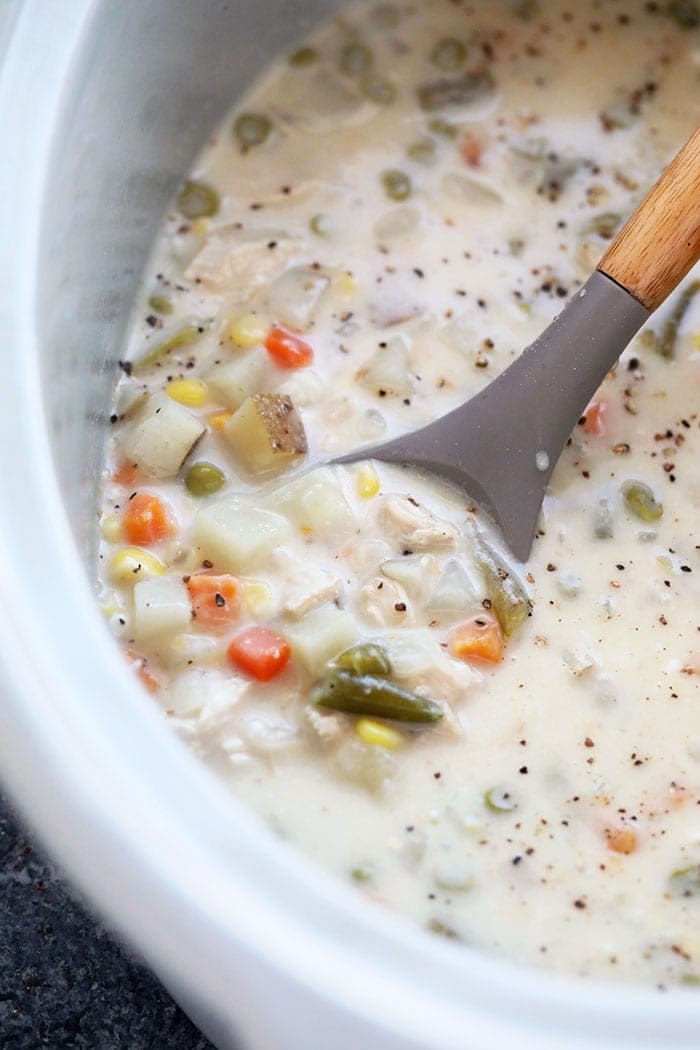 crockpot chicken pot pie soup with a spoon