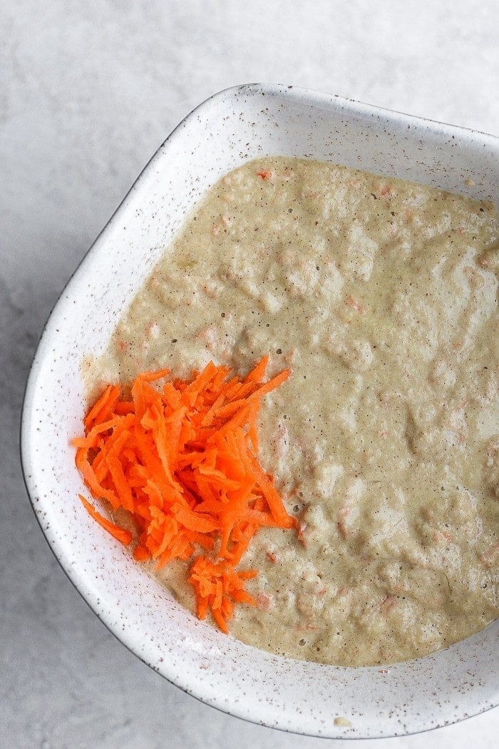 healthy carrot cake pancake ingredients in a bowl