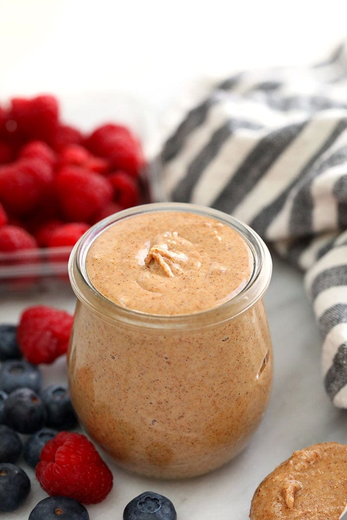Make your own creamy and delicious Vanilla Bean Almond Butter with just a few whole ingredients and a food processor. No additives or refined sugars in this simple almond butter recipe. Make a batch today! vanilla bean almond butter in a jar.