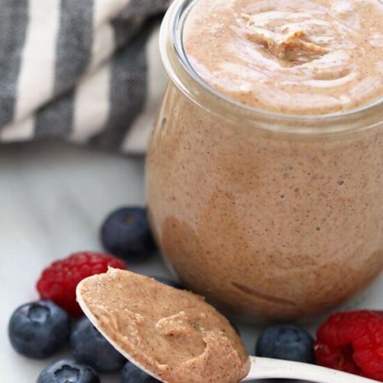 Homemade Almond Butter on a spoon and in a jar