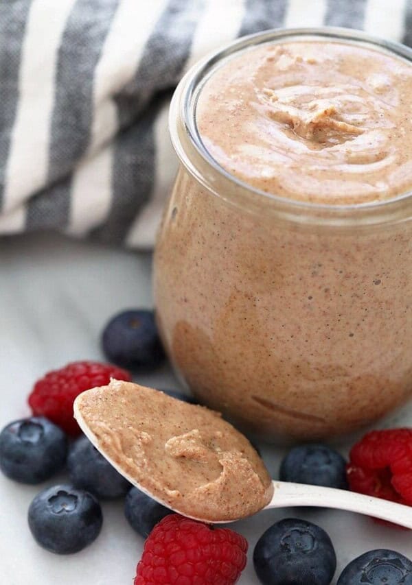 Homemade Almond Butter on a spoon and in a jar