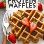 Protein waffles topped with strawberries.