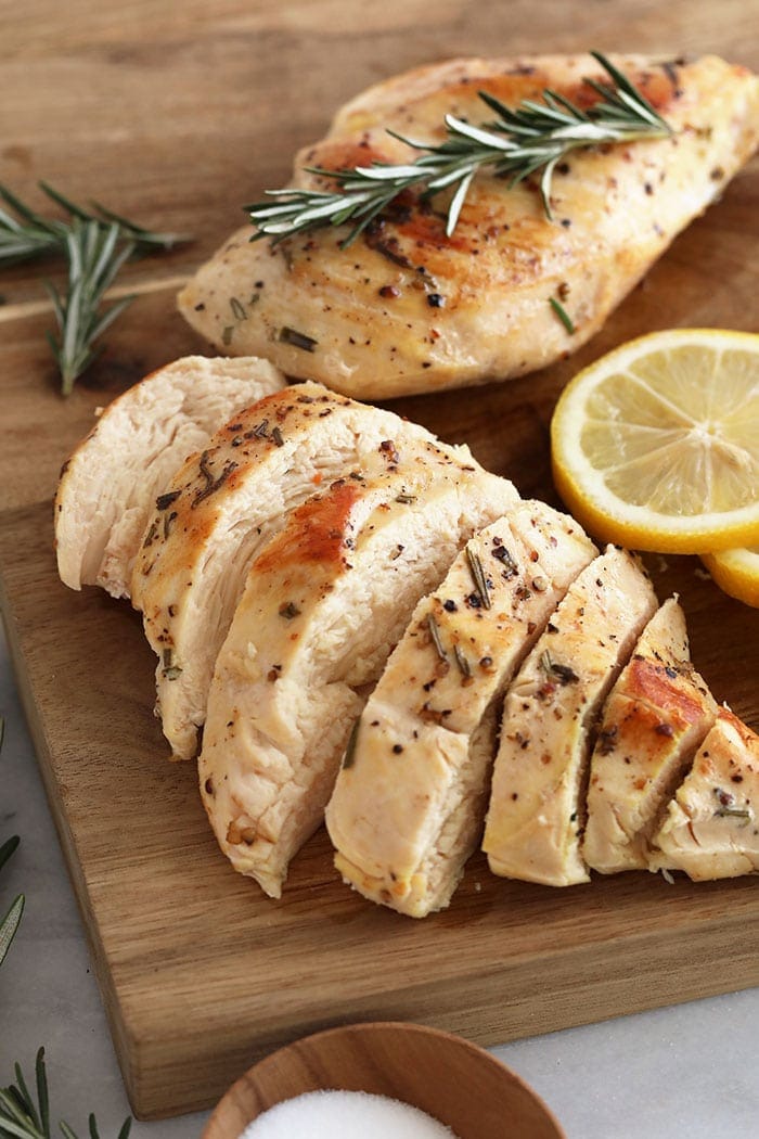 sliced chicken breast on a cutting board.